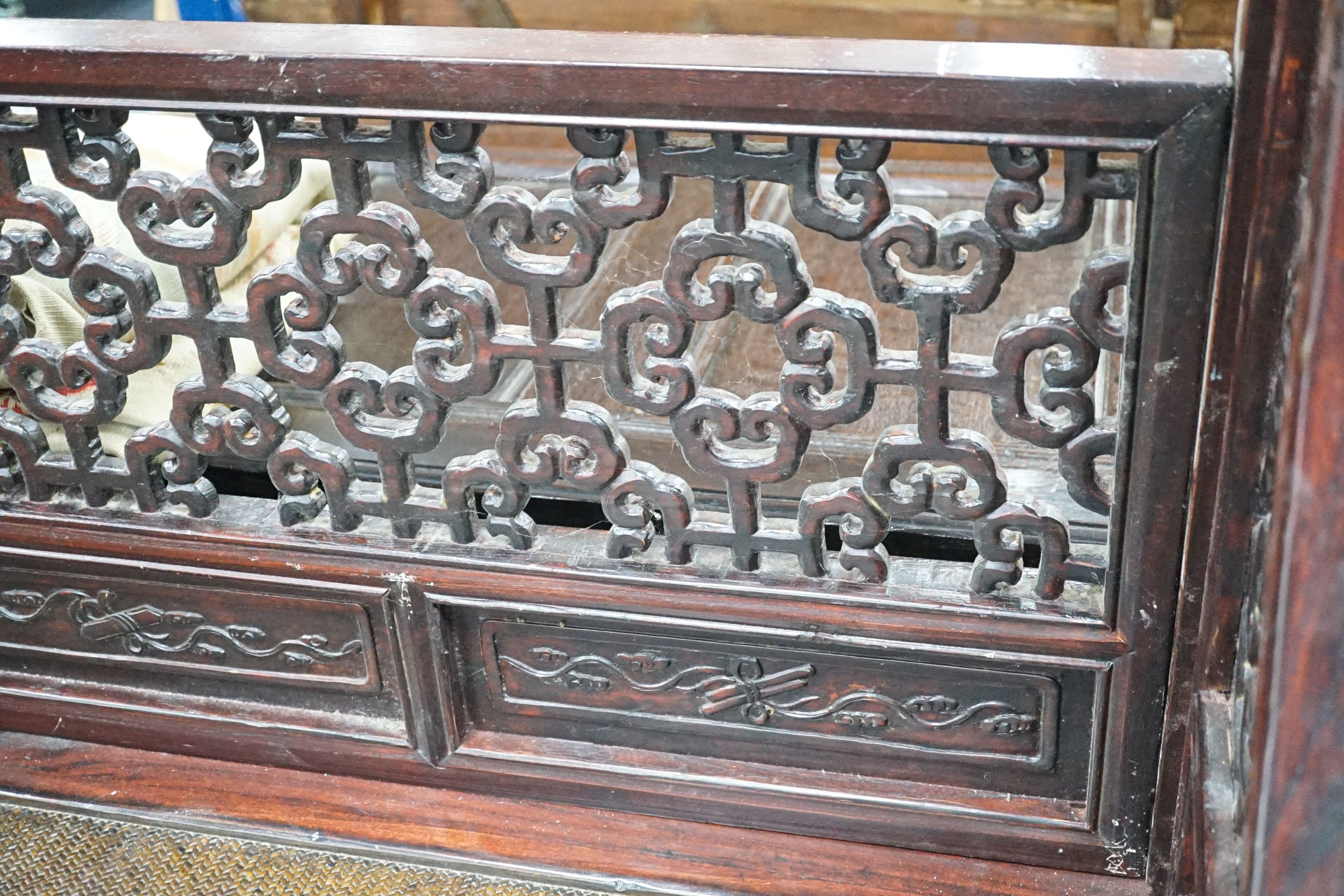 A Chinese carved elm opium bed, width 160cm, depth 207cm, height 225cm